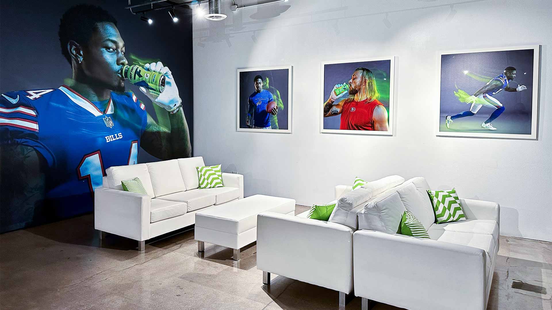 Fast Twitch lounge with sofas and photos of athletes drinking Fast Twitch.